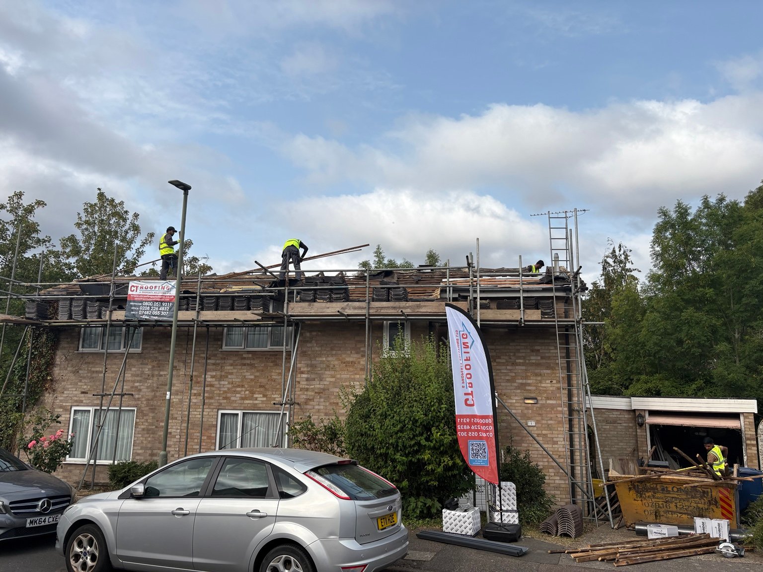 Existing tiles being carefully removed