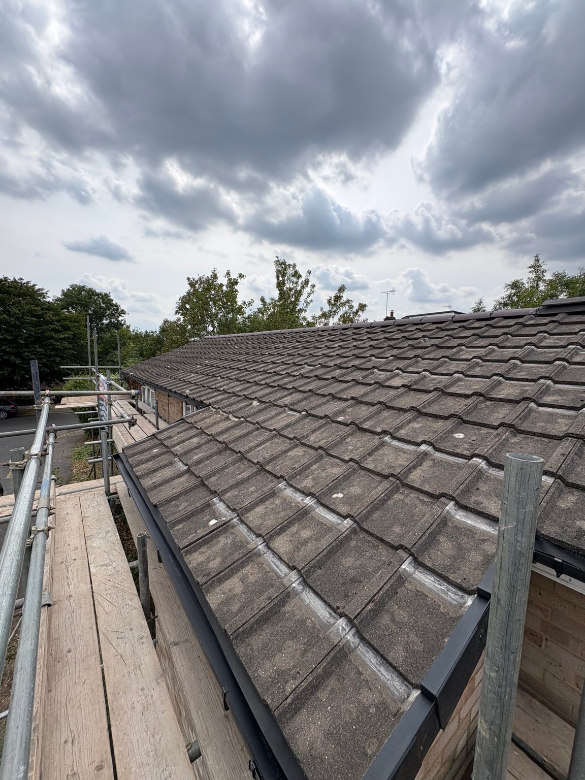 Reused tiles reinstated across the main roof