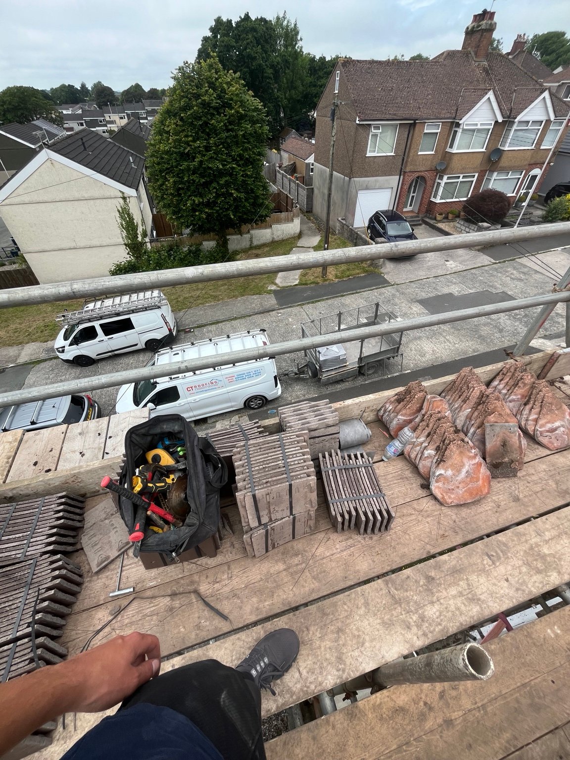 Original roof tiles removed and stacked for disposal