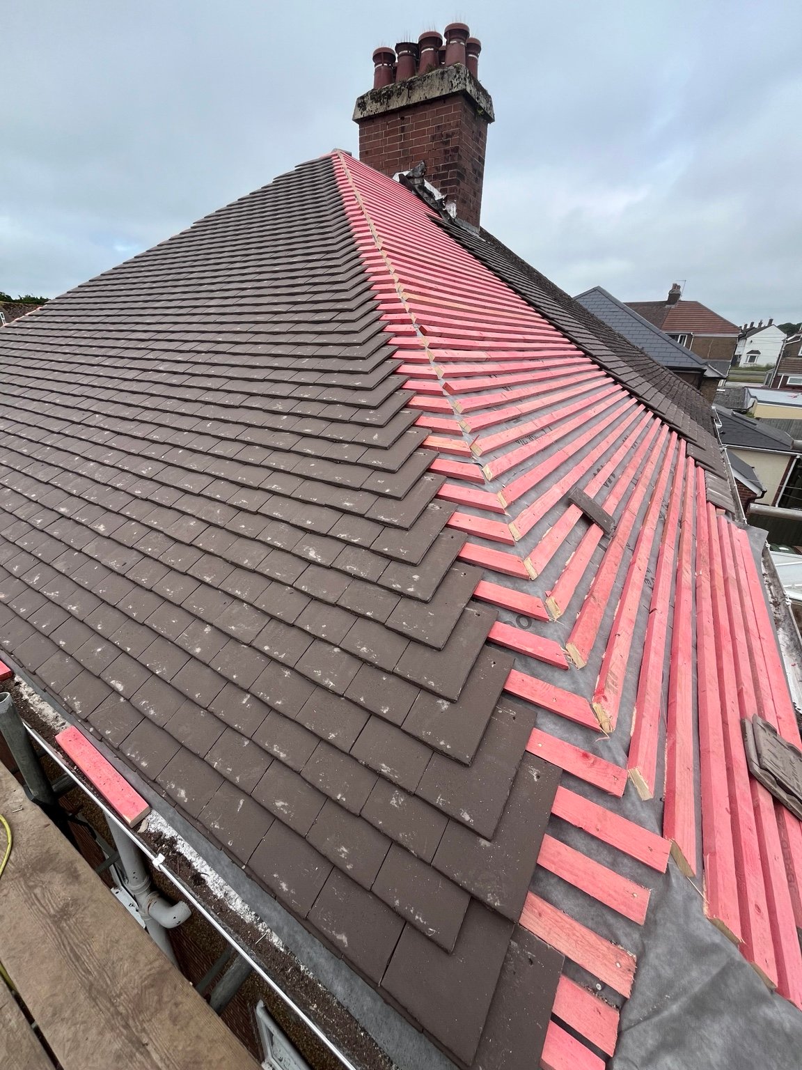 Completed brown concrete plain-tile roof replacement