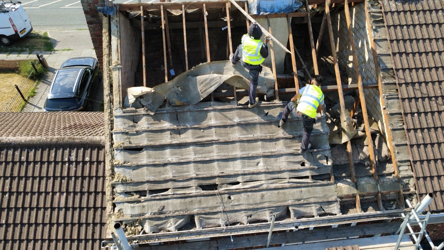 Old felt and roof covering being removed
