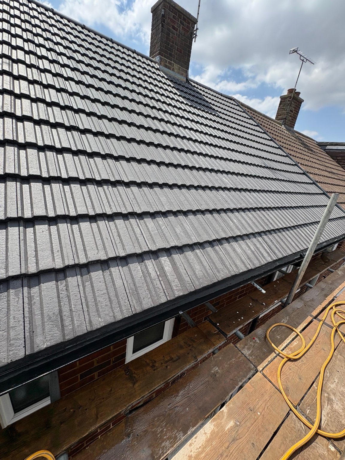 Completed grey tiled roof slope