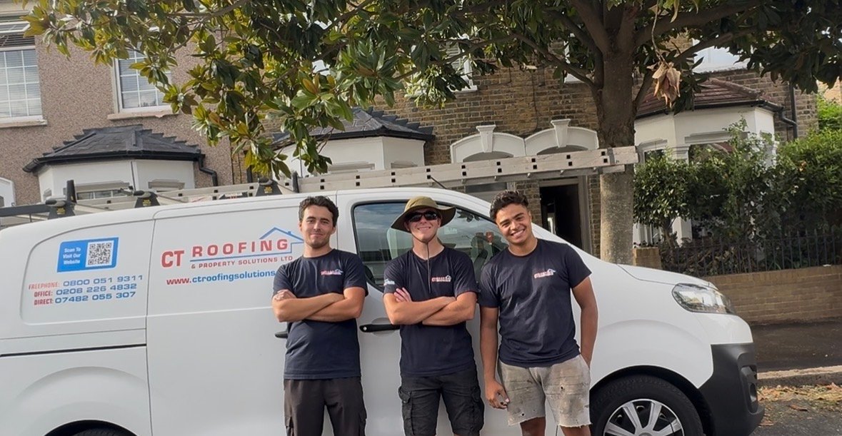 CT Roofing team standing beside the CT Roofing company van
