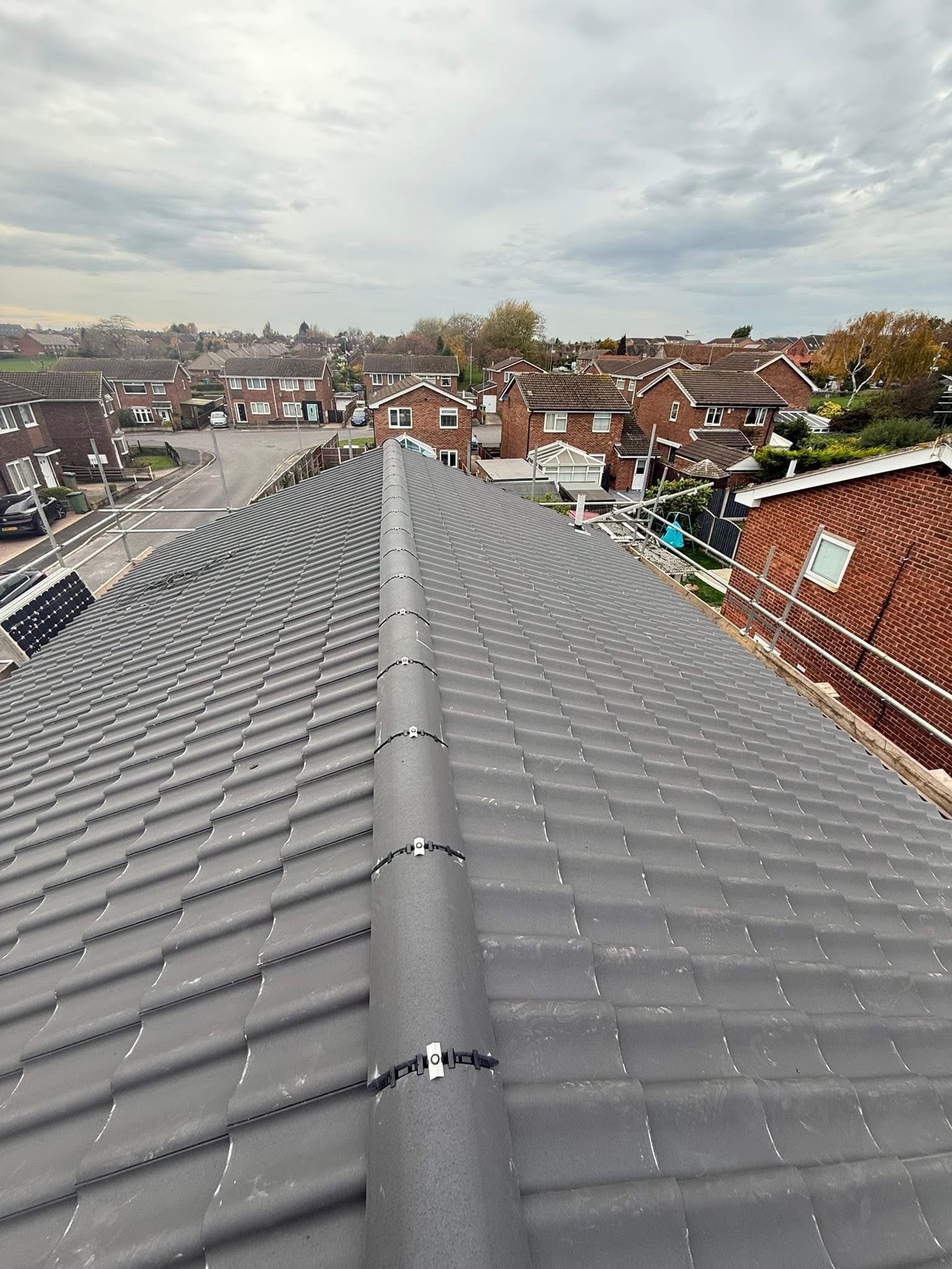 Completed new tiled roof installed by CT Roofing